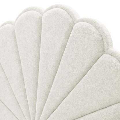 Close-up of scalloped upholstered headboard texture in off-white