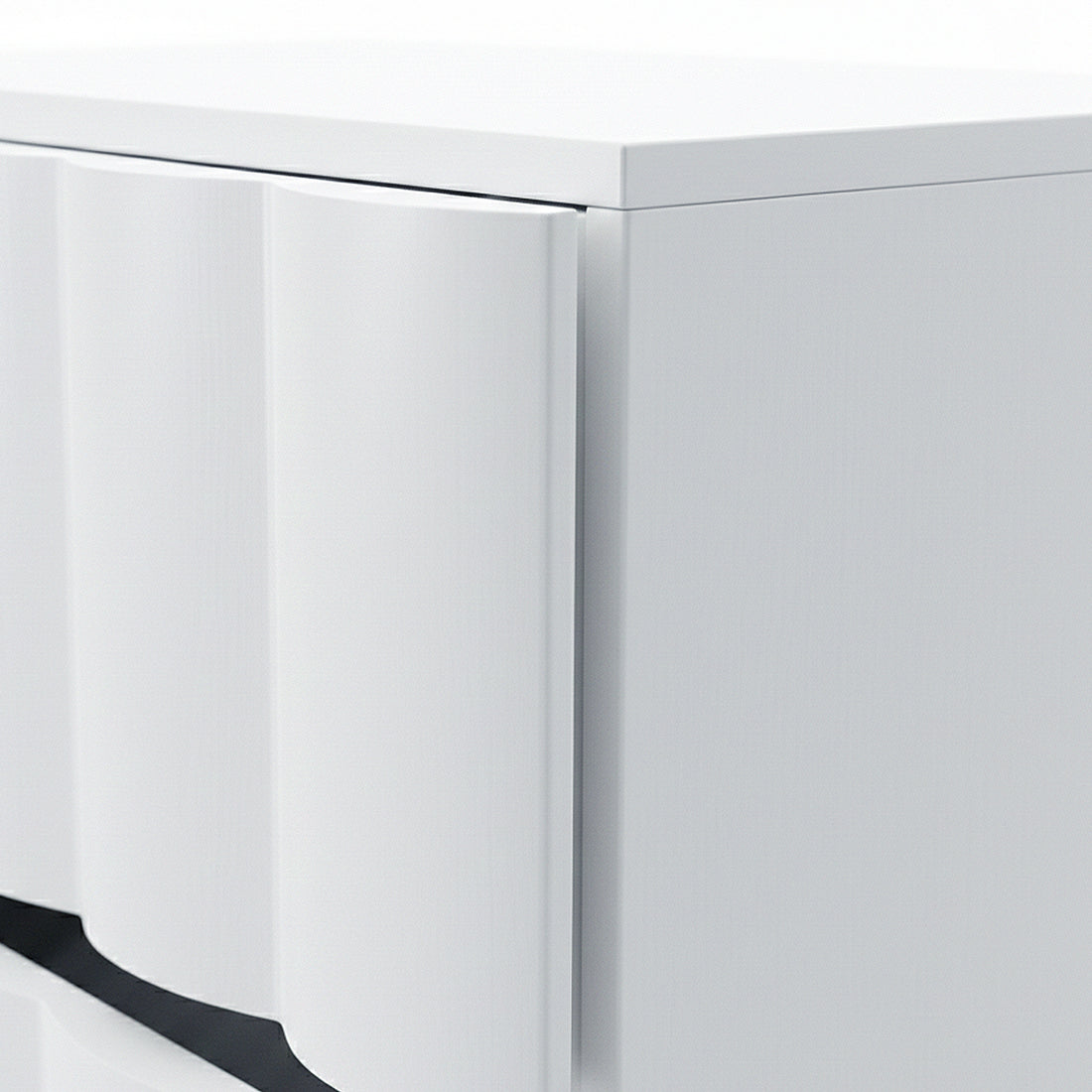 Close-up of textured wave detail on white cabinet