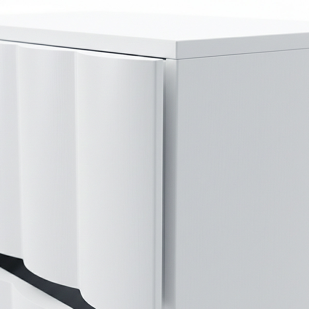 Close-up of textured wave detail on white cabinet