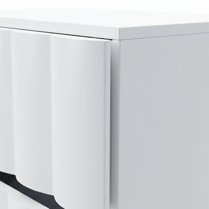 Close-up of textured wave detail on white cabinet