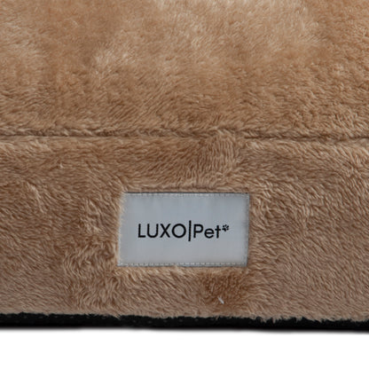 Macro view of beige plush material with LUXO|Pet label