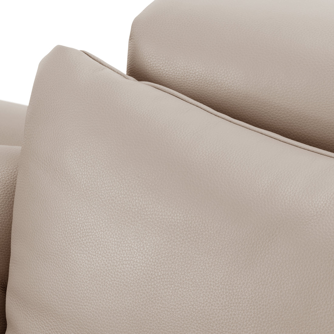 Close-up of beige leather upholstery texture and stitching