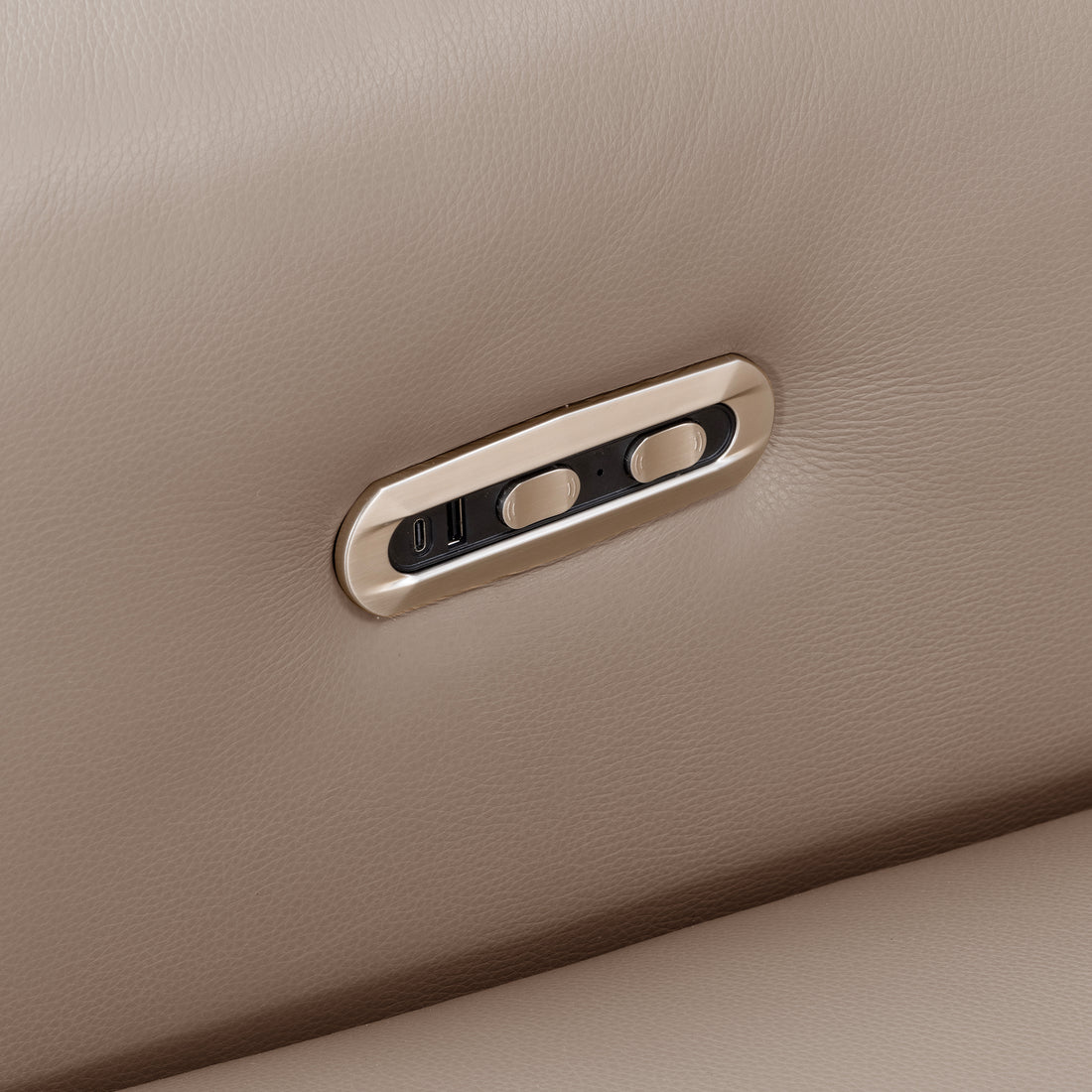 Close-up of reclining sofa control buttons in taupe upholstery