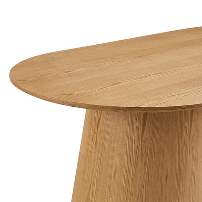 Partial view of a wooden table showing one end and part of the base on white background