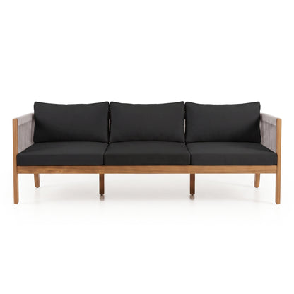 Modern four-seater sofa with black cushions on a white background