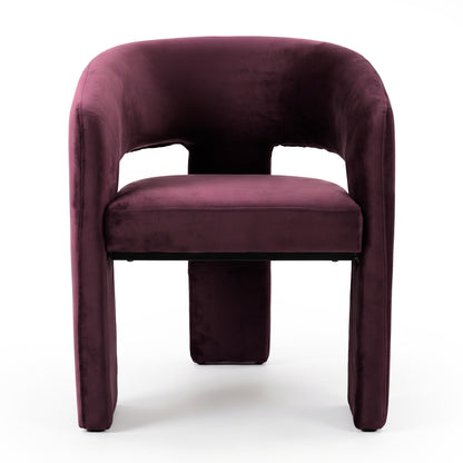 Front view of full burgundy velvet chair on white background