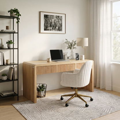 Stylish home office with a light wood desk, chair, shelving, plants, and natural light.
