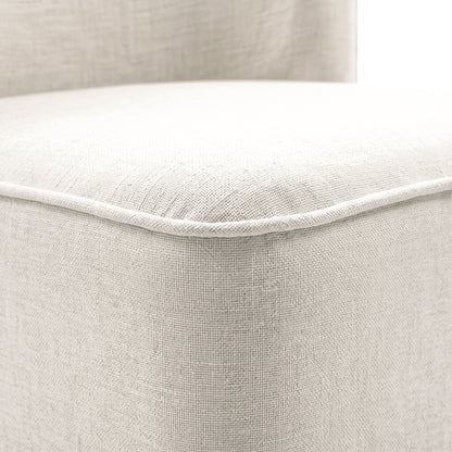 Close-up of light upholstered fabric and stitching detail