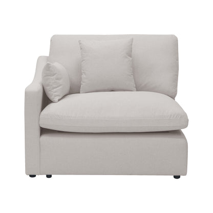 Modern light beige upholstered armchair on a white background