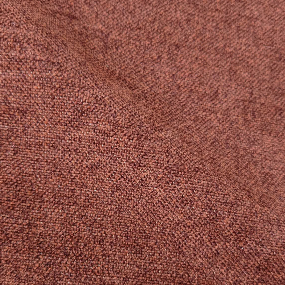 Macro close-up of terracotta woven upholstery fabric