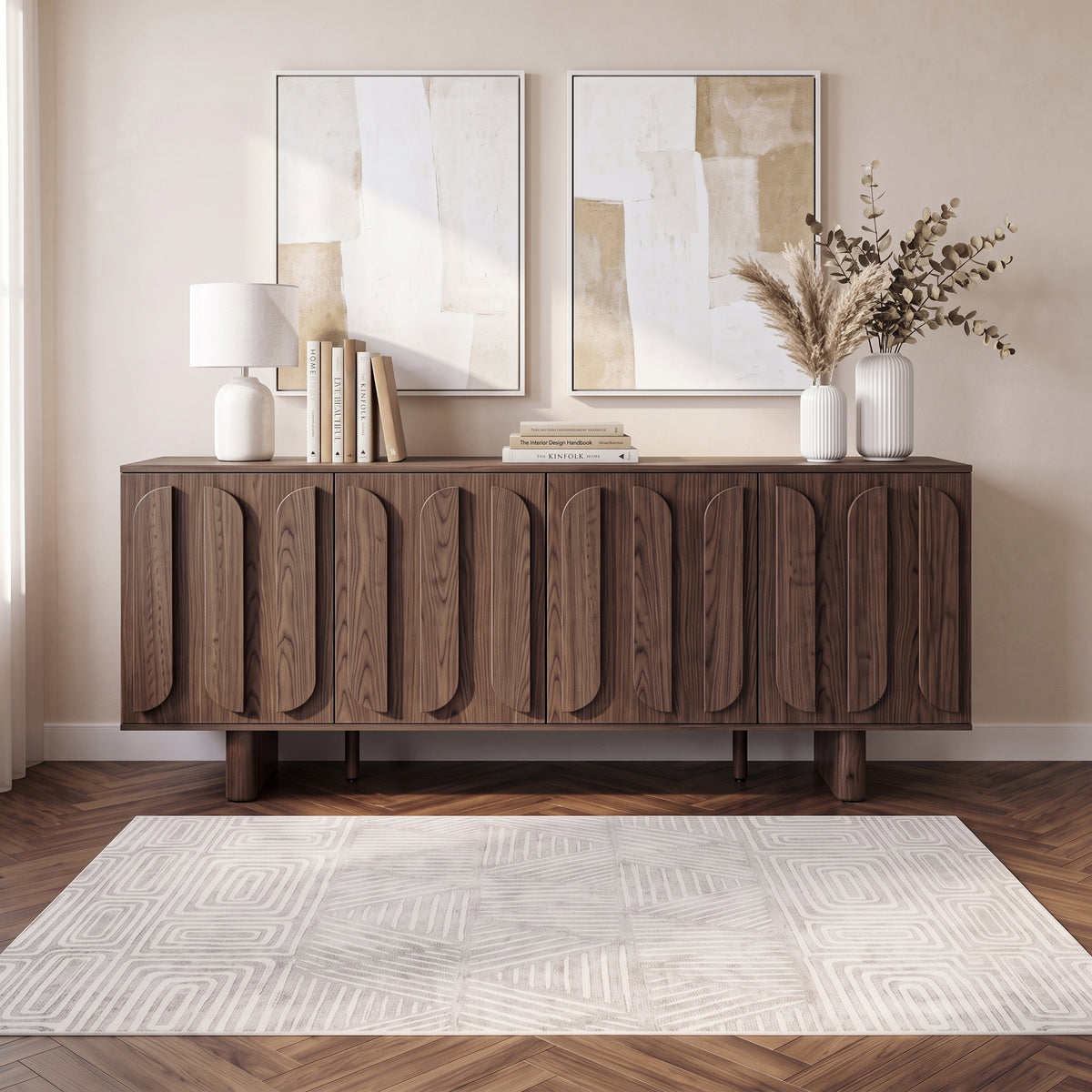 Wooden sideboard styled in a modern room with rug, lamp, artwork, and decor.