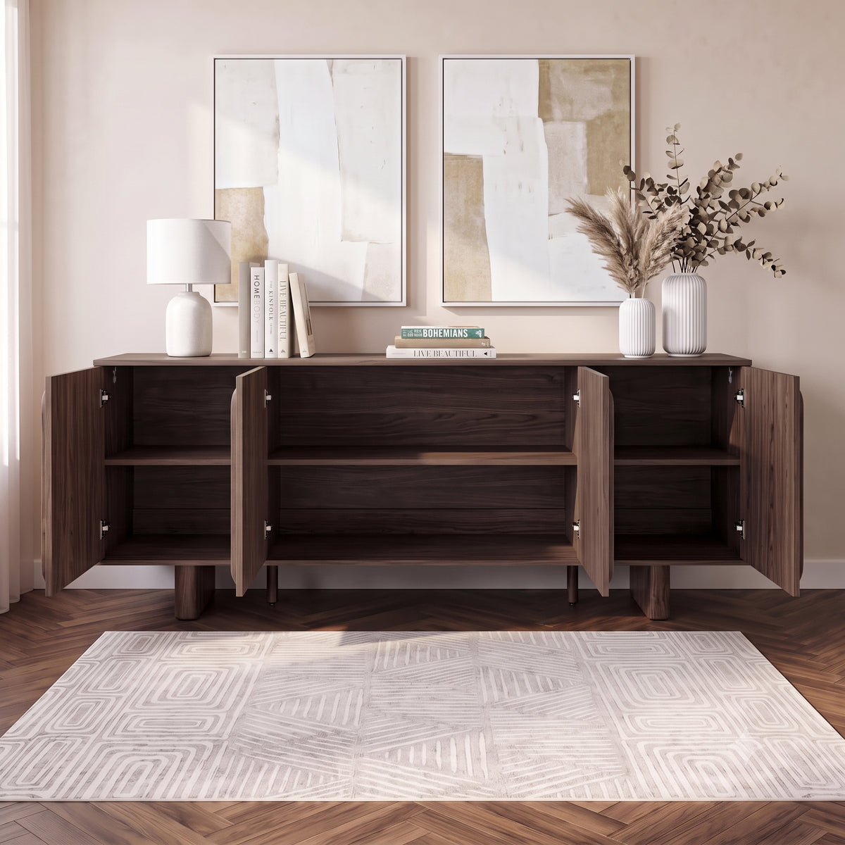 Dark wood sideboard in a styled room with lamp, books, artwork, and rug.