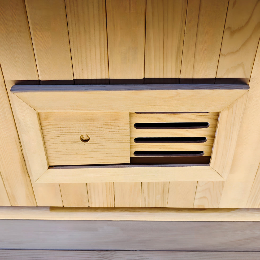 Close-up of a wooden vent or air intake panel