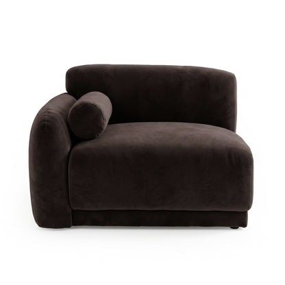 Dark brown armless lounge module with rounded edges and bolster pillow on white background