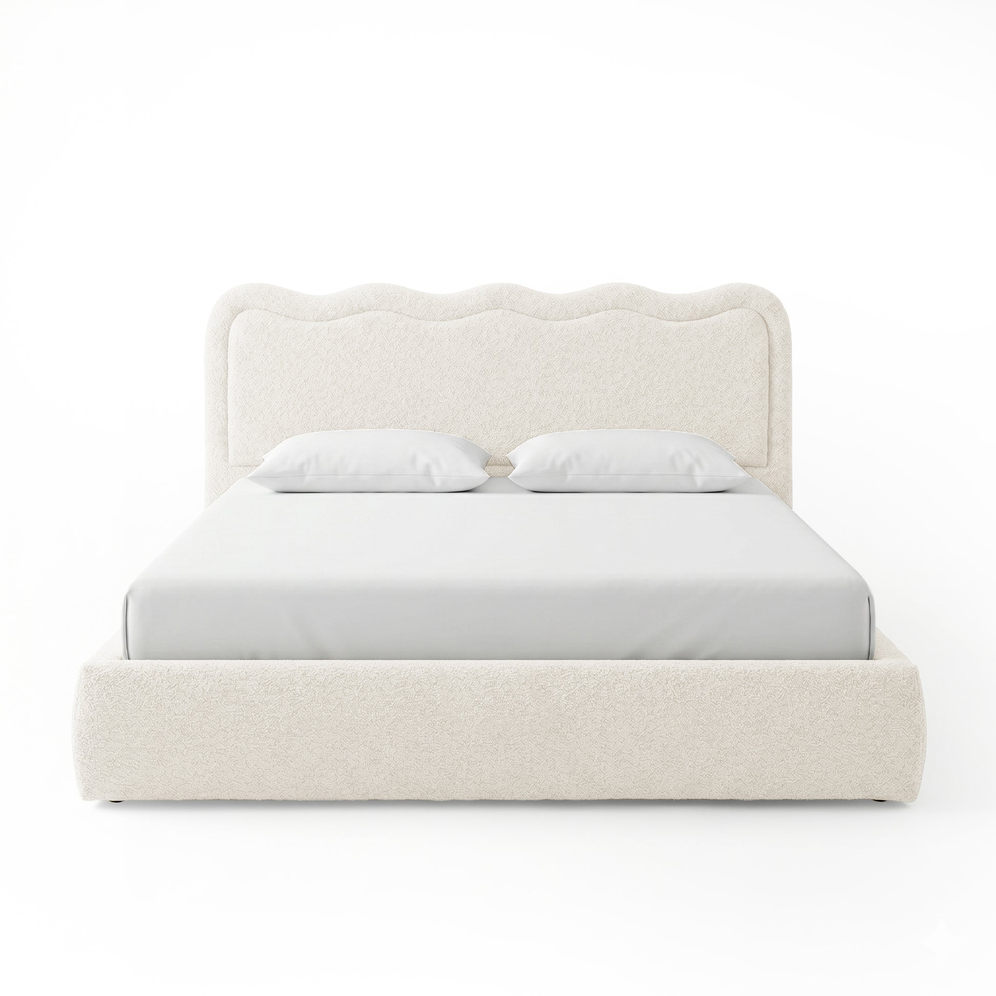 Front-facing upholstered bed with scalloped headboard on white background