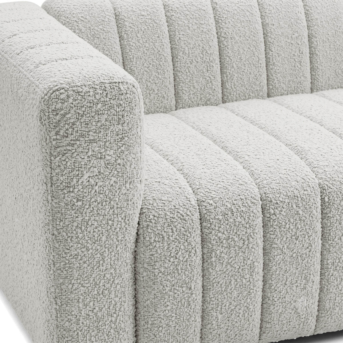 Close-up of a modern sofa arm and seat upholstery