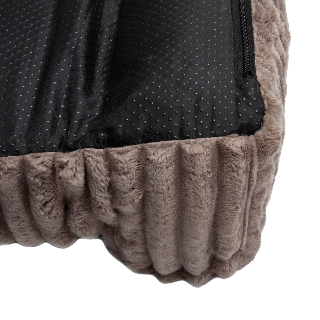 Detail of pet bed corner showing fabric and non-slip underside