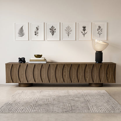Modern wooden sideboard styled in a room with decor and wall art