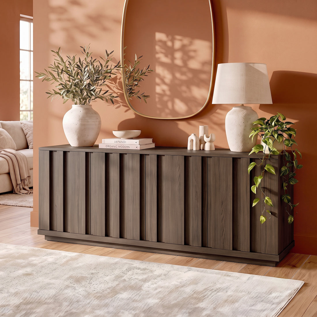 Dark wood sideboard styled in a warm modern living room