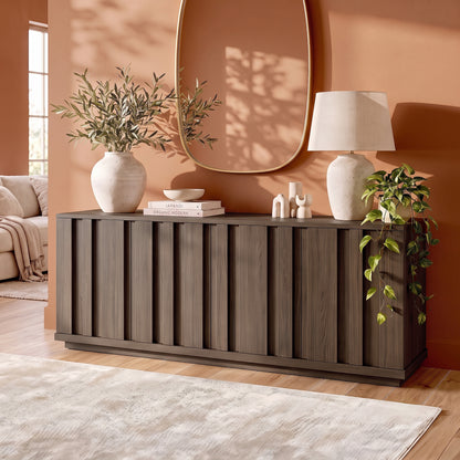 Dark wood sideboard styled in a warm modern living room