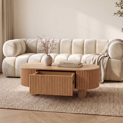 Oval wooden coffee table styled in a modern living room
