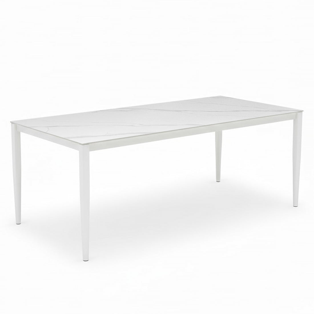 Cabria 7 Piece Sintered Stone Outdoor Dining Set in Beige, featuring a sleek rectangular table with a white marble-patterned top and slim, tapered legs, complemented by six cushioned dining chairs.