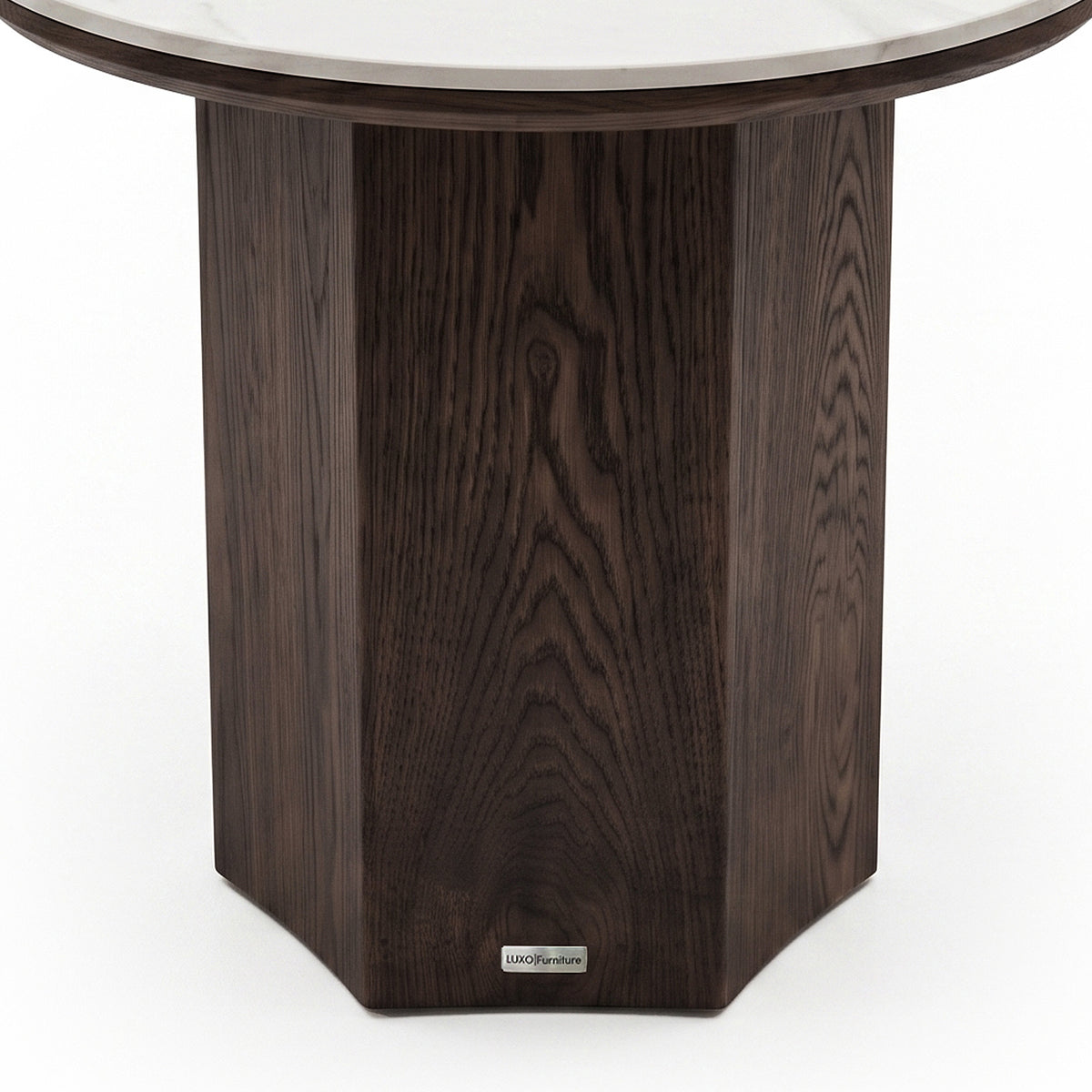 Partial close-up of a round table base with dark wood finish on a white background