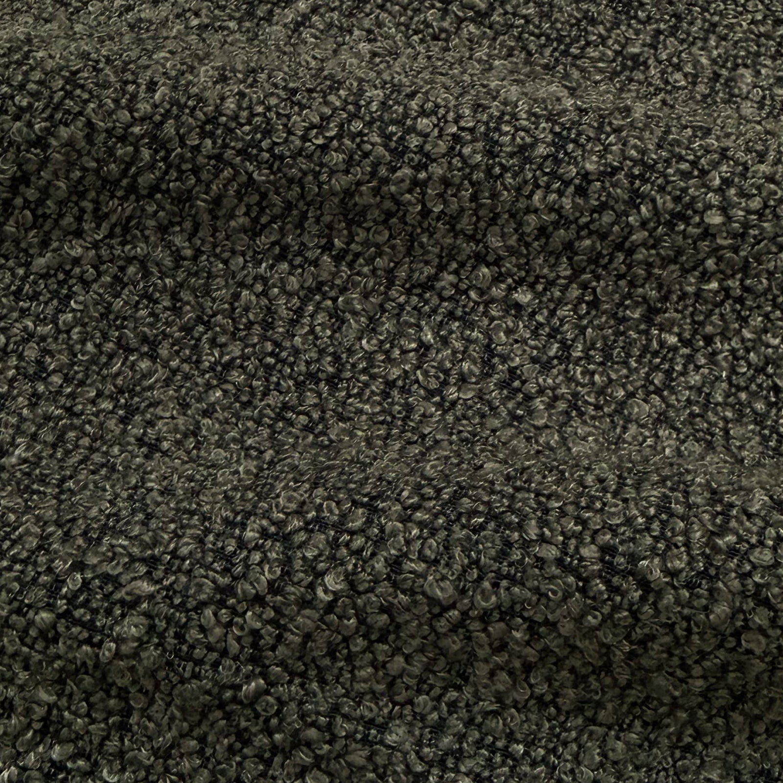 Extreme close-up of charcoal boucle fabric texture