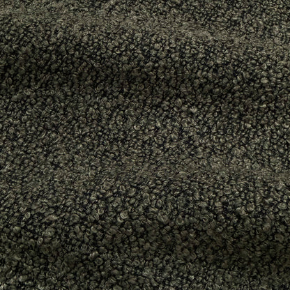 Extreme close-up of charcoal boucle fabric texture