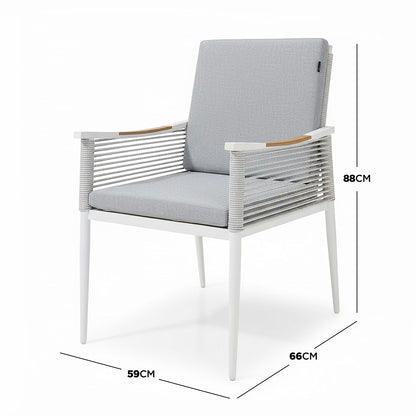 Casara 9 Piece Outdoor Dining Set in White and Grey features a sleek design with a metal frame, light-gray rope-wrapped sides, wooden arm accents, and cushioned seating, perfect for stylish alfresco dining.