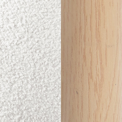 Close-up of white textured surface next to pale wood grain detail