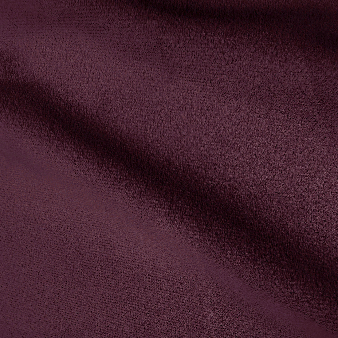 Close-up texture of plum velvet upholstery