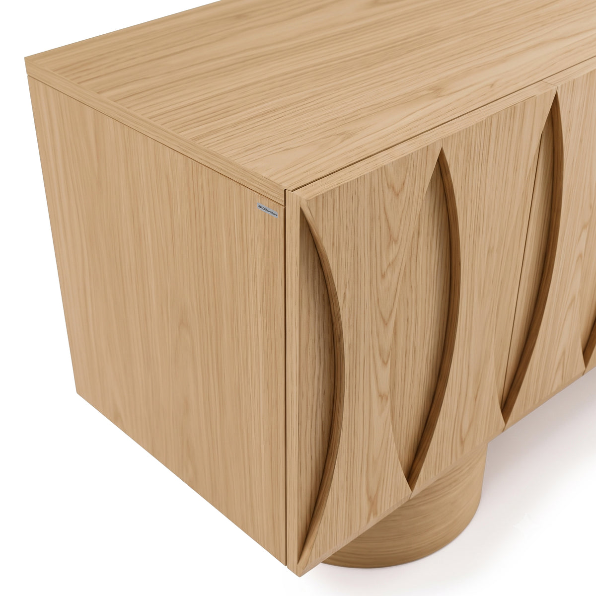 Close-up angled view of a wooden cabinet with carved front details