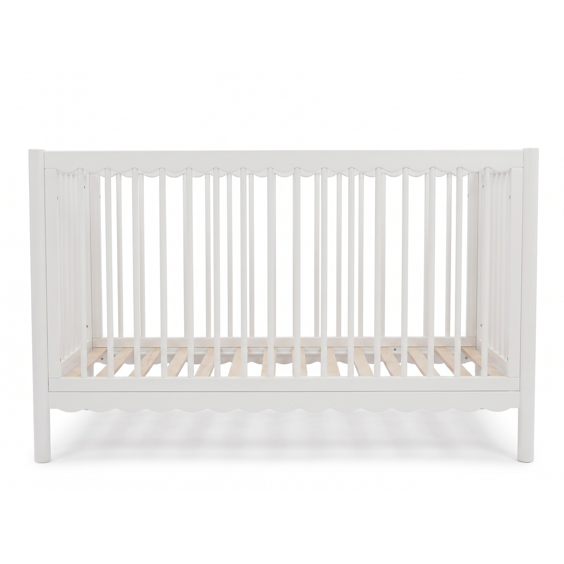 White baby crib with slatted sides on a white background