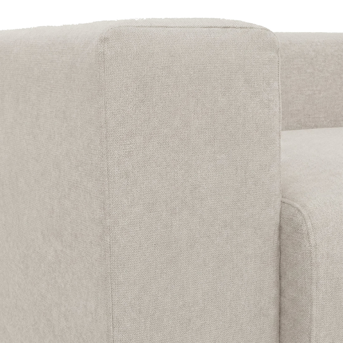 Close-up of sofa armrest and fabric texture on white background
