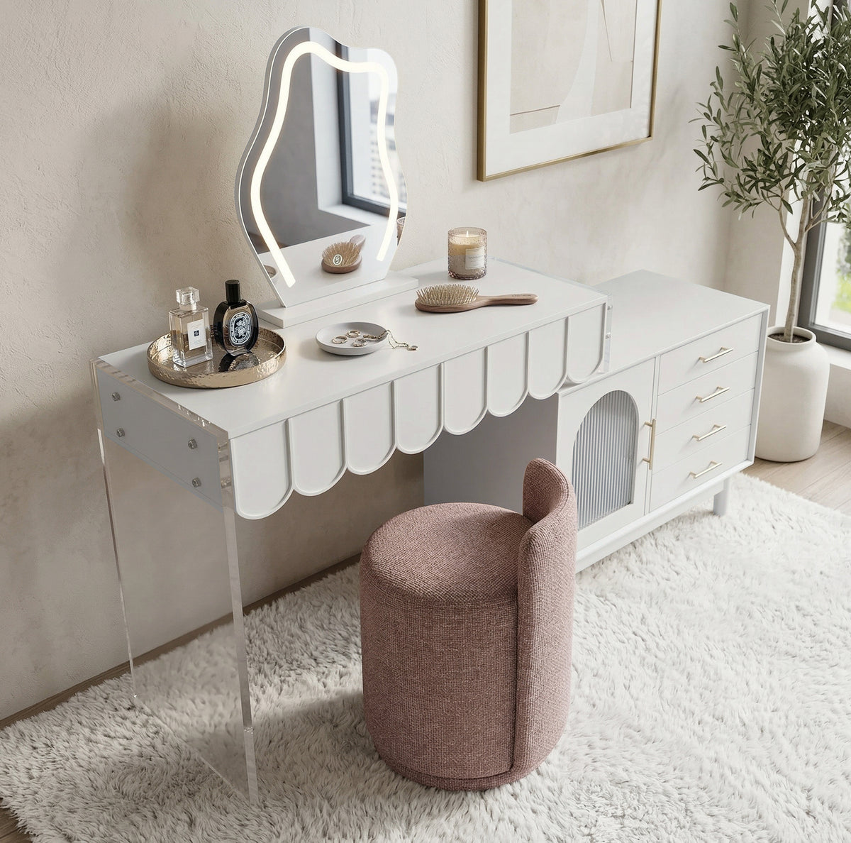 Lifestyle image of modern white vanity table with scalloped edge, LED mirror, and matching blush stool in a decorated room