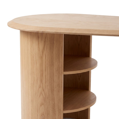 Partial view of a light wood desk end with open shelves on a white background.