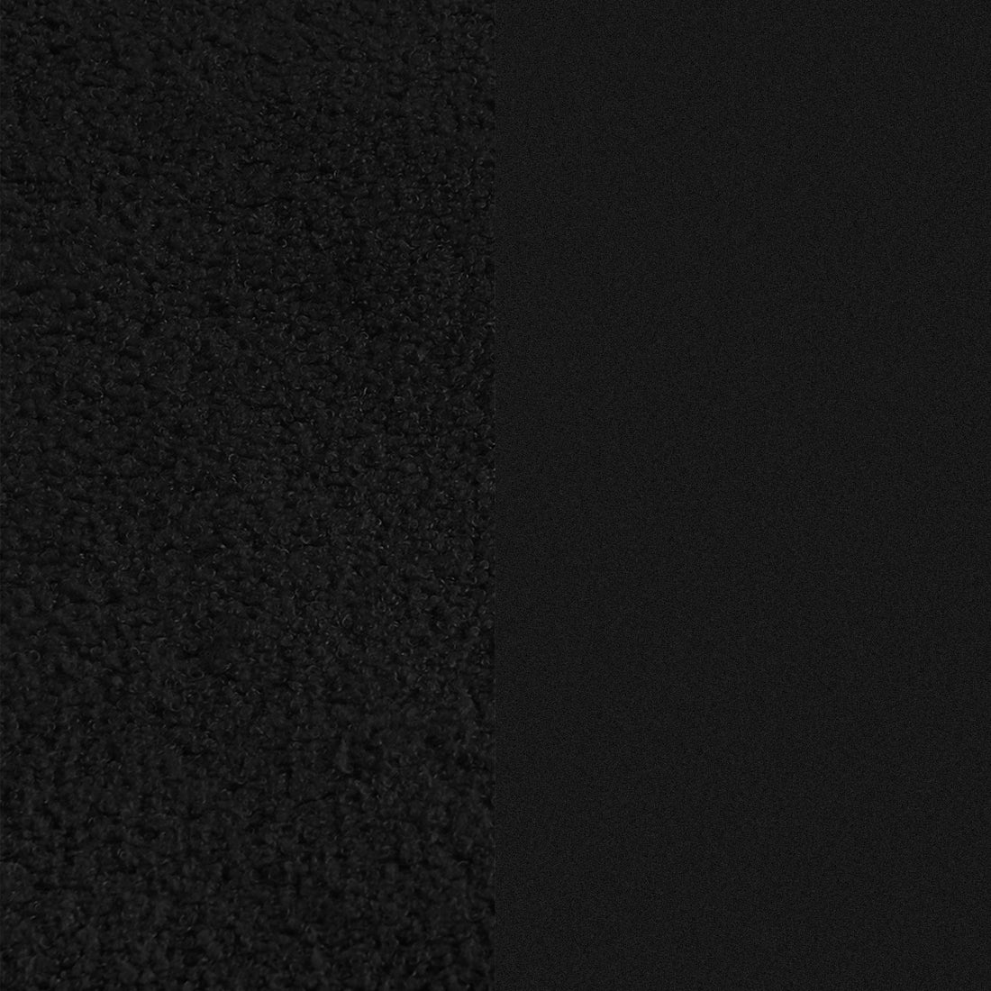 Close-up of black textured material against a dark background