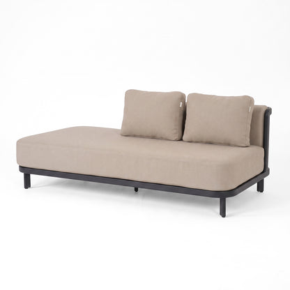 Beige chaise lounge with black frame on white background.