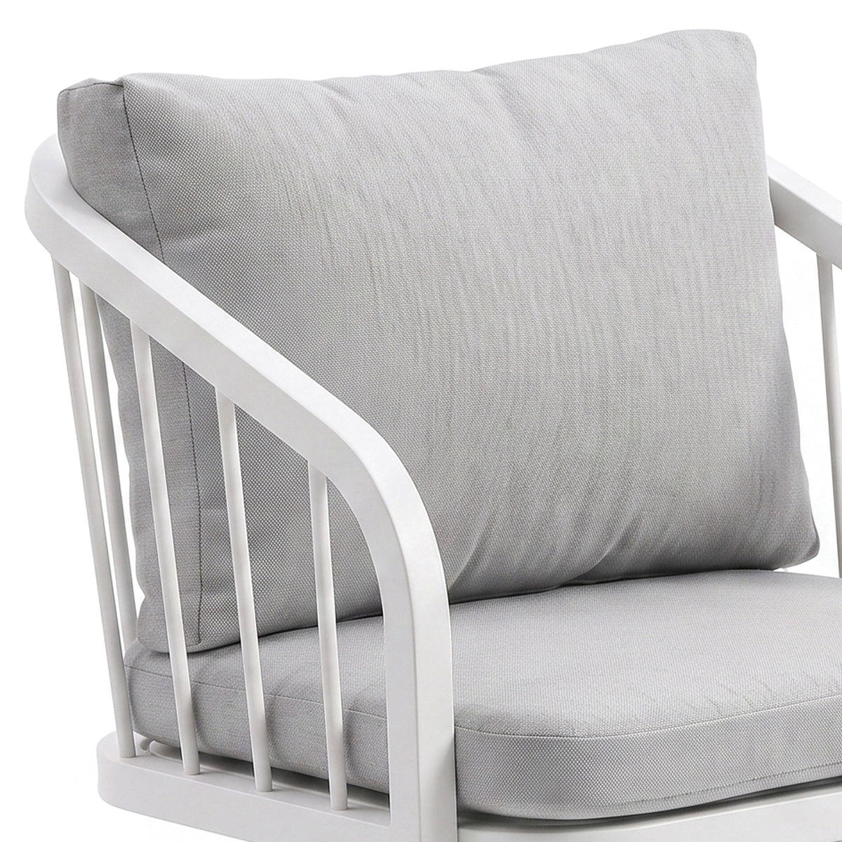 Upper half of cushioned chair on white background