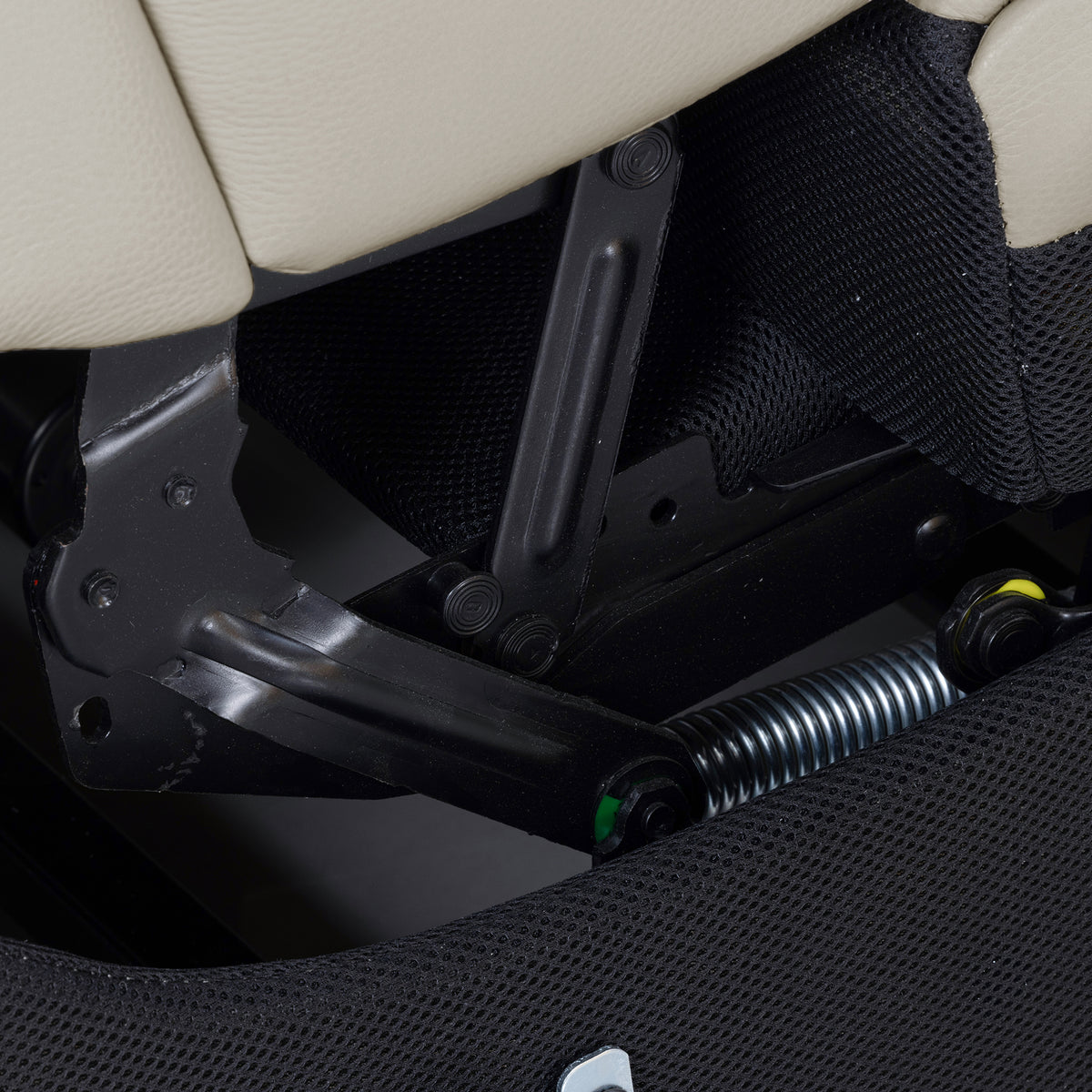 Close-up of the underside mechanism of upholstered furniture.