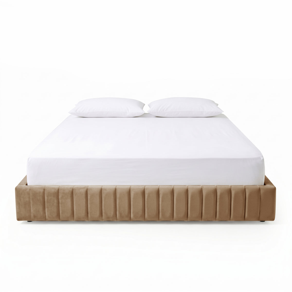 Beige upholstered bed with white bedding and pillows on white background