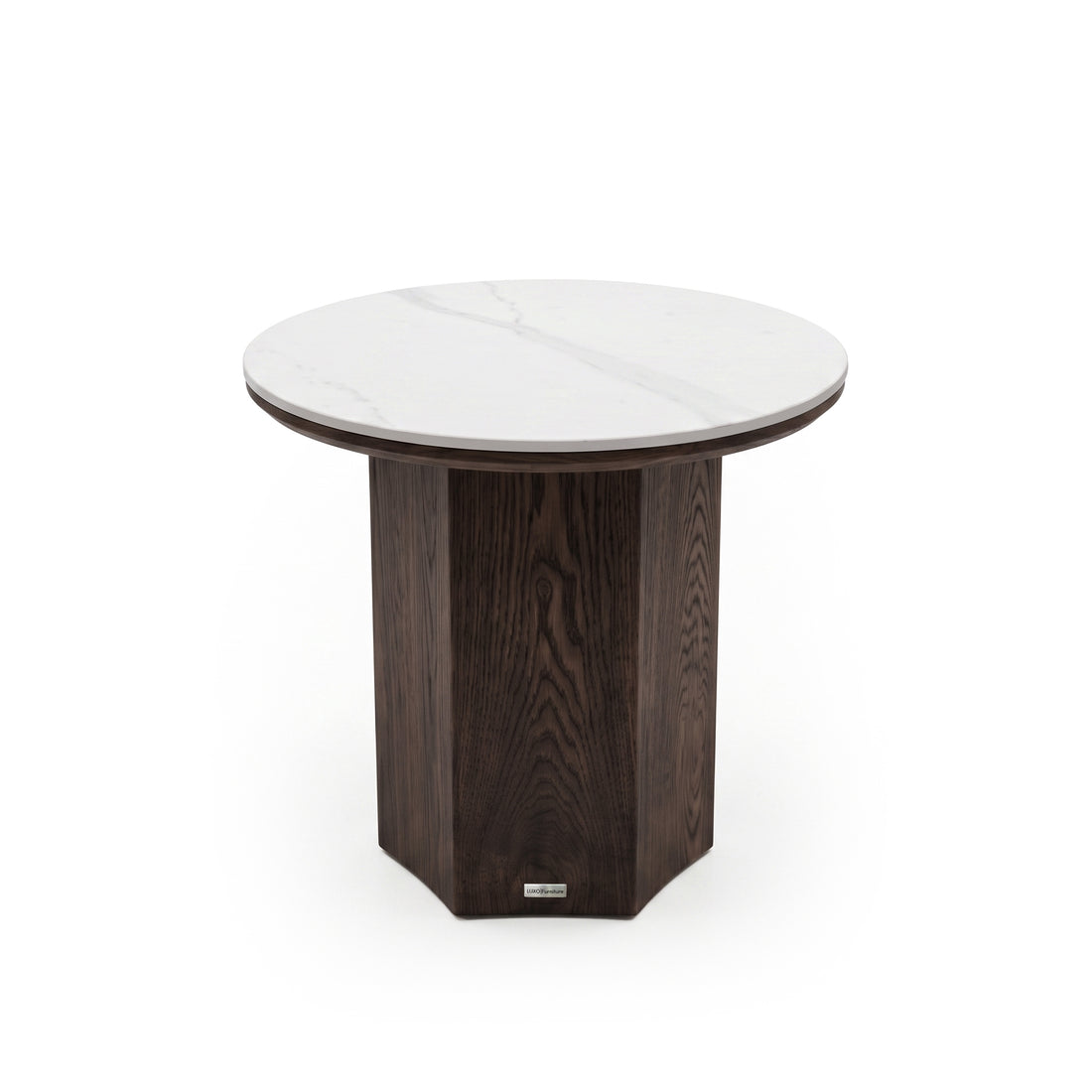Round side table with a white marble top and dark geometric pedestal base on a white background