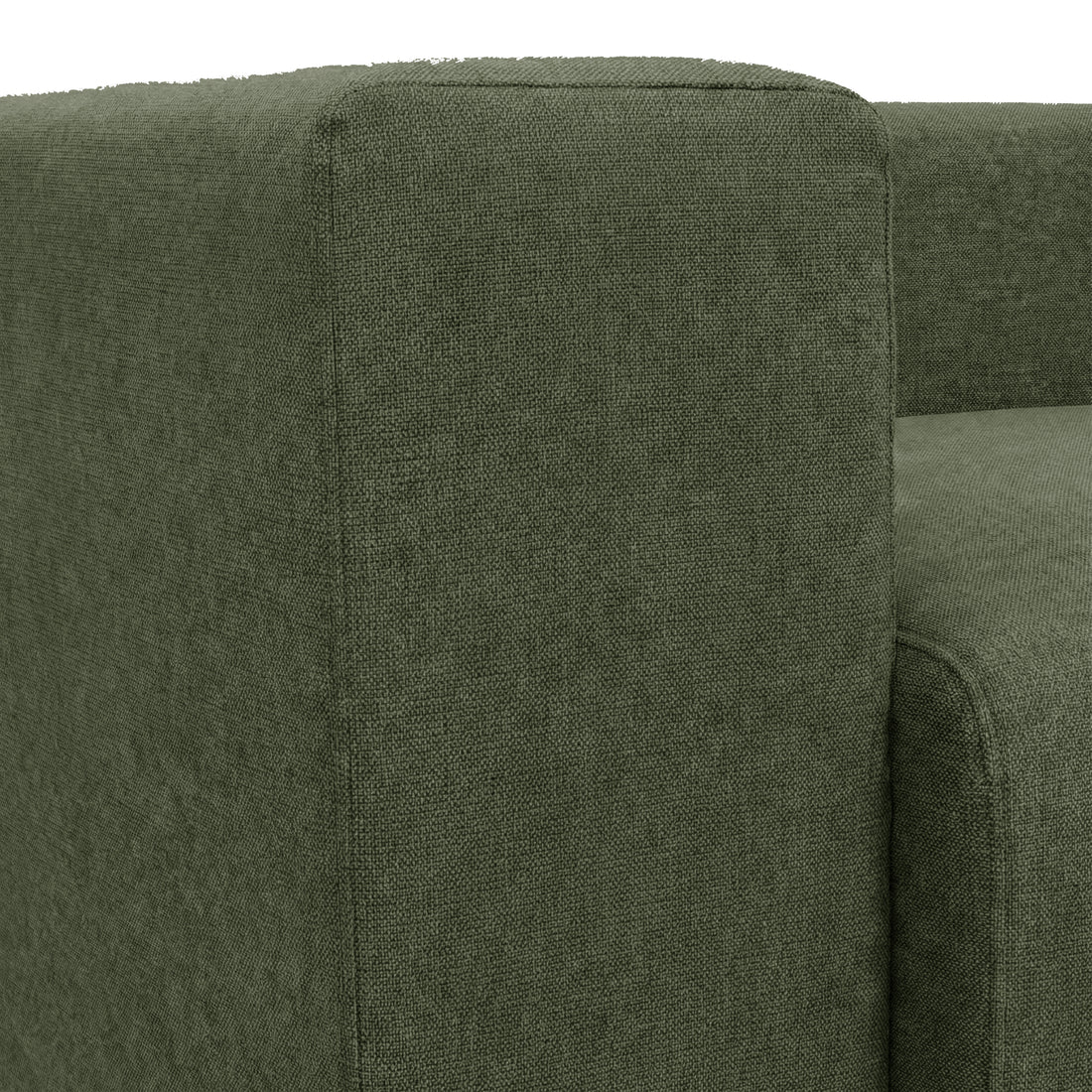 Close-up of dark green sofa armrest and seat cushion on white background