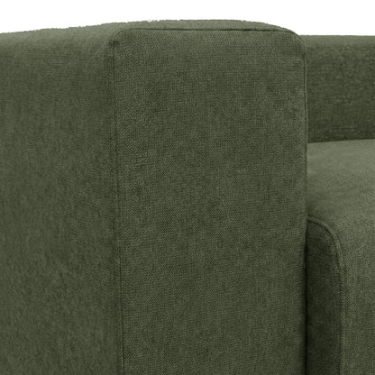 Close-up of dark green sofa armrest and seat cushion on white background