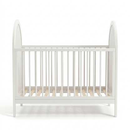 Full view of a white baby crib on a white background