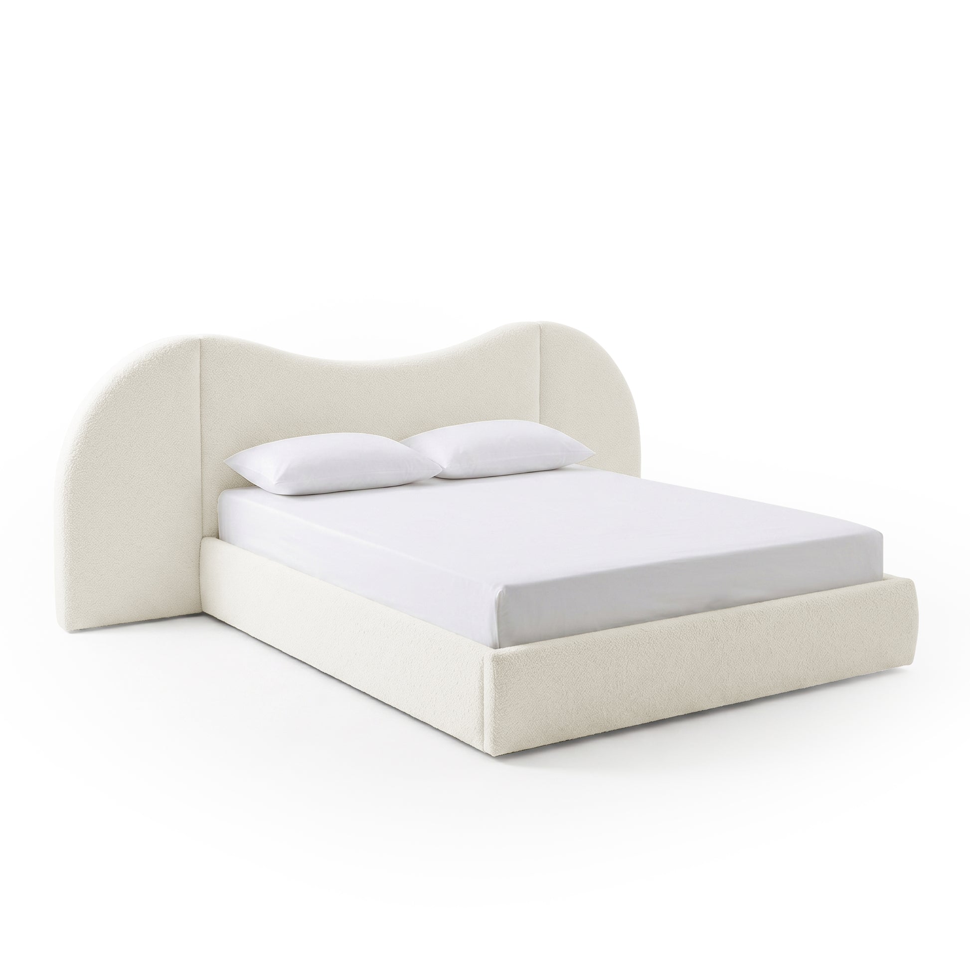 Modern upholstered bed with white sheet and pillows on white background