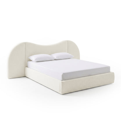 Modern upholstered bed with white sheet and pillows on white background