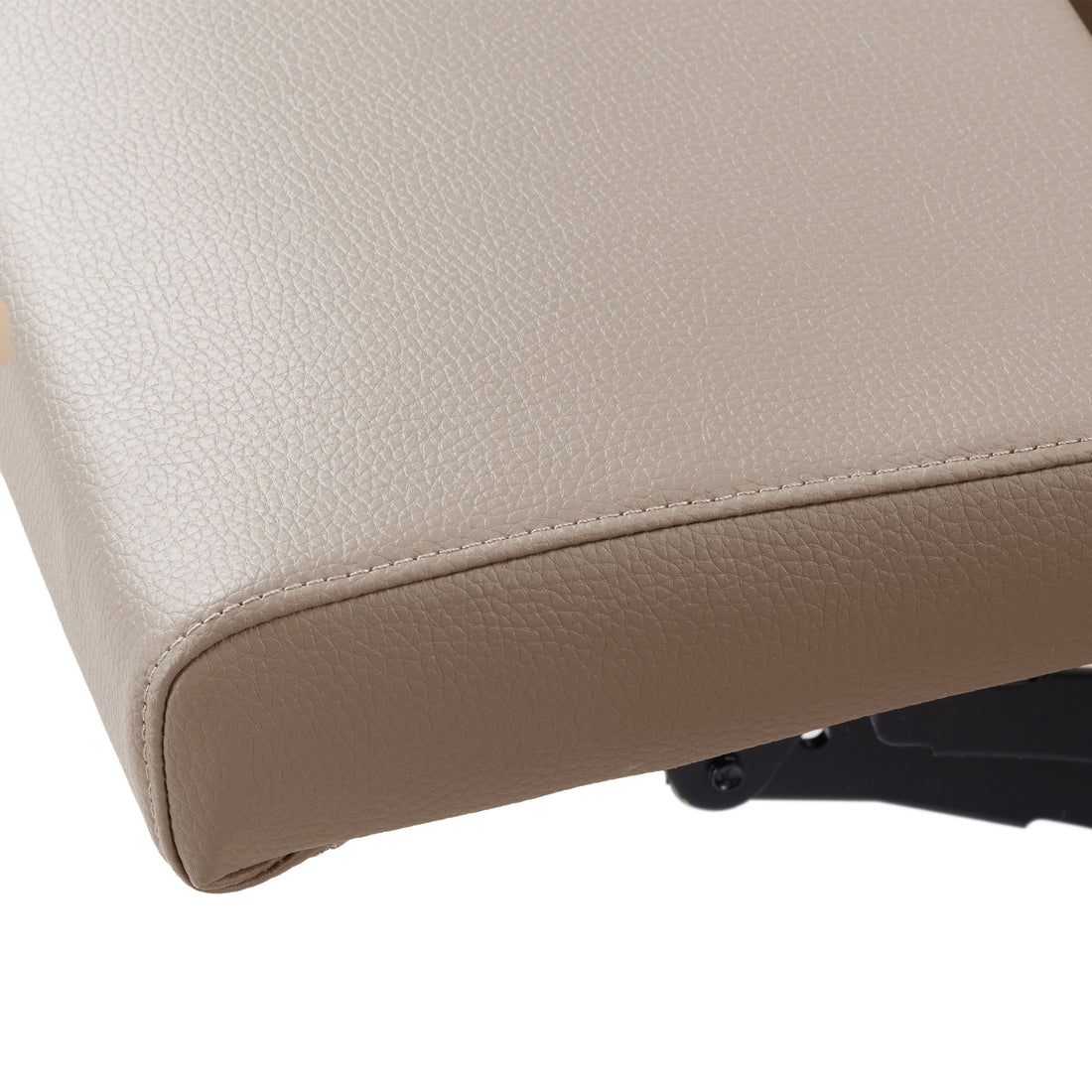 Close-up of a beige upholstered cushion corner with visible stitching