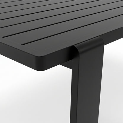 Close-up of the Positano 6 Seater Outdoor Dining Set's black slatted tabletop corner, showcasing the sleek bent metal leg, emphasizing its modern outdoor design.